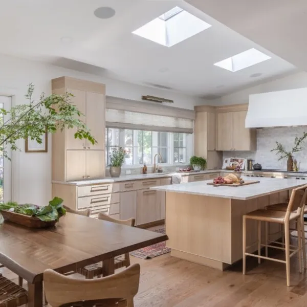 Custom kitchen featuring white oak cabinets, skylights, and a large island with seating.